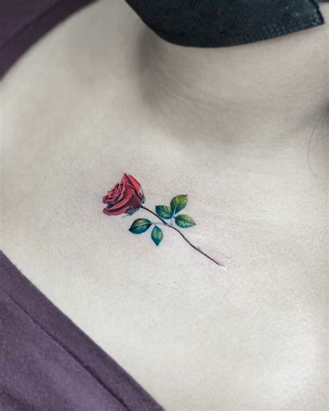 small rose tattoo between breast|Small and Simple Rose Tattoo Ideas for Men and。